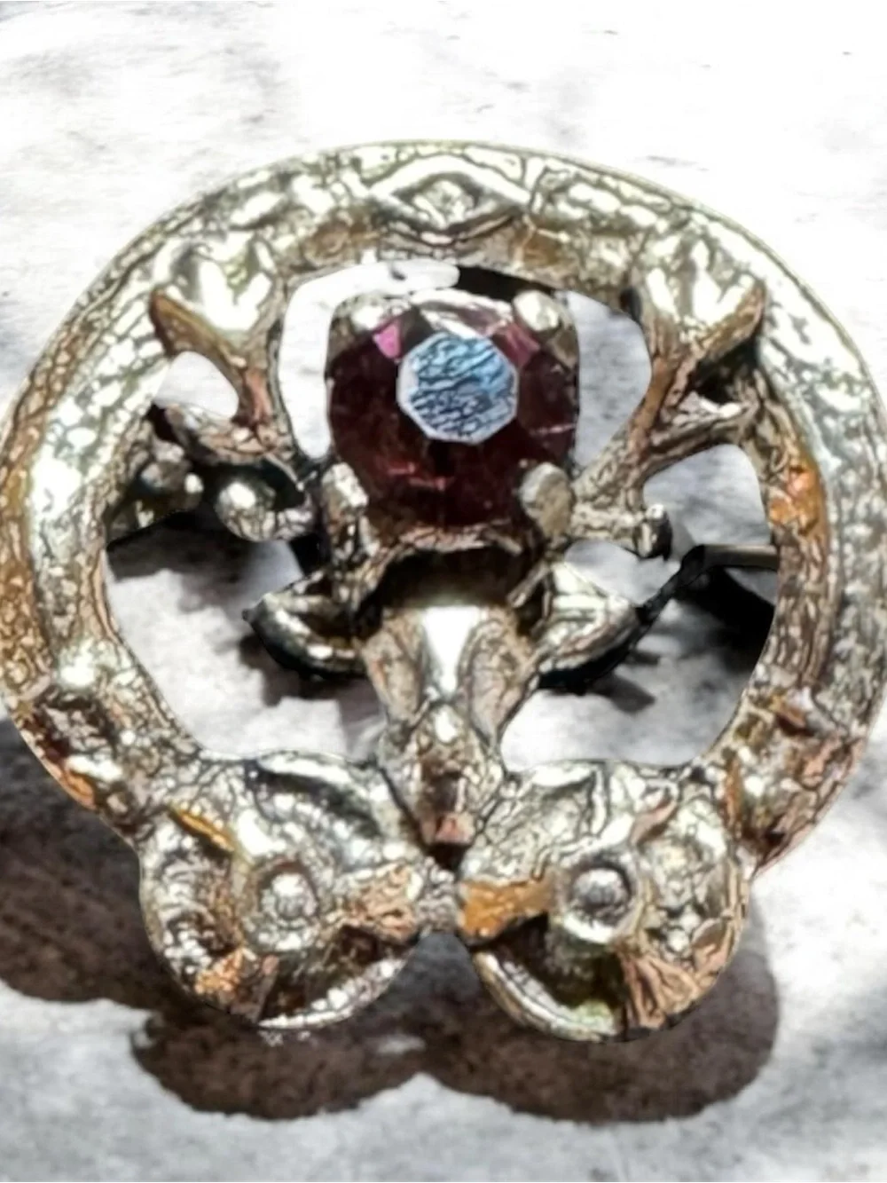 Vintage Silver-Tone Brooch with Deep Red Crystal Accent